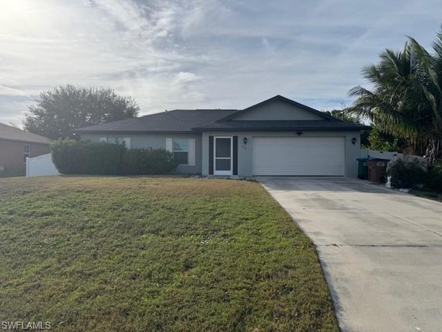 Image 1: Ranch-style house featuring a front lawn, driveway, an attached garage, and stucco siding
