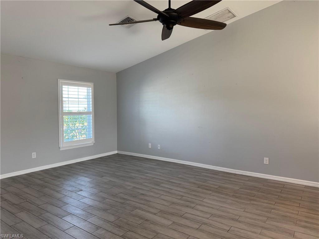 Image 3: Unfurnished room featuring wood finish floors and a ceiling fan