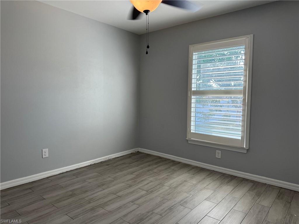 Image 4: Empty room with wood finished floors and ceiling fan