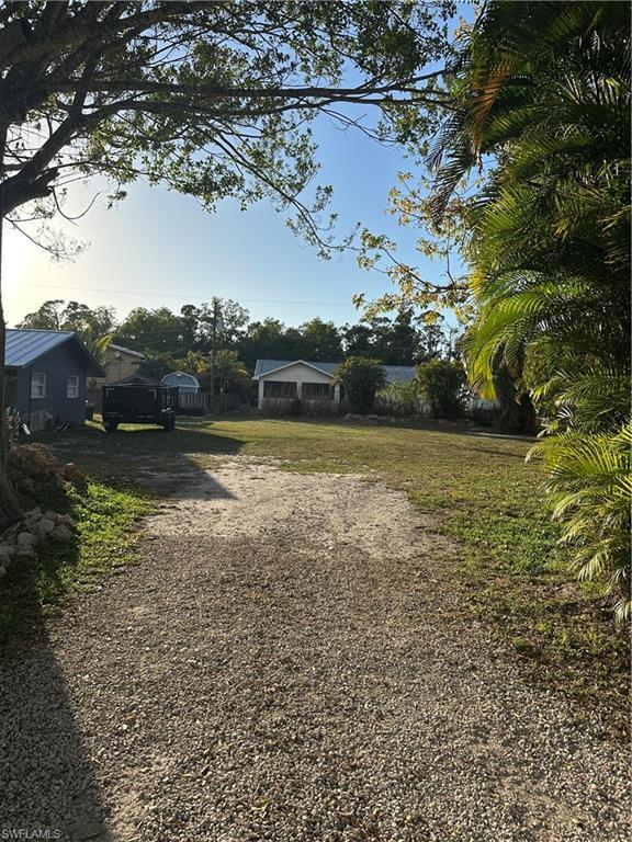 Image 3: View of yard featuring driveway