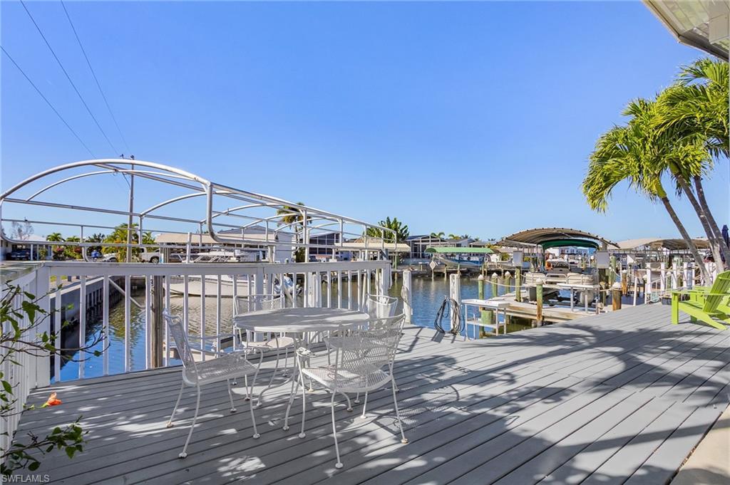 Image 3: Shaded patio overlooking the canal.