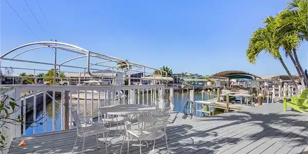 Image 3: Shaded patio overlooking the canal.