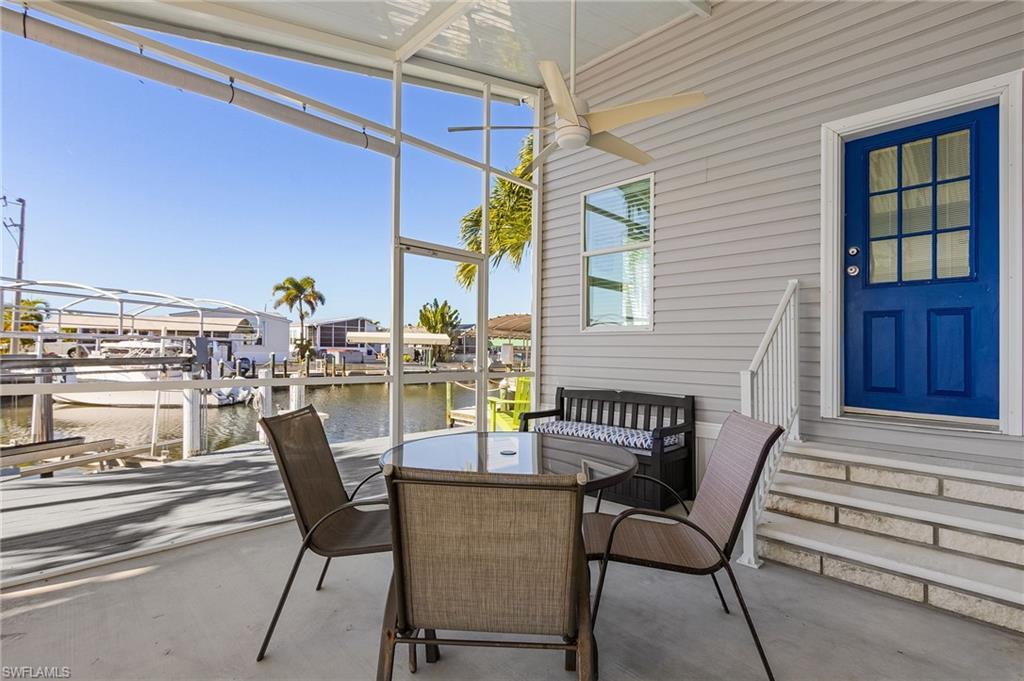 Image 4: Screened Patio overlooking the boat lift and canal.