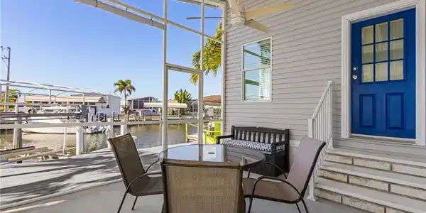 Image 4: Screened Patio overlooking the boat lift and canal.
