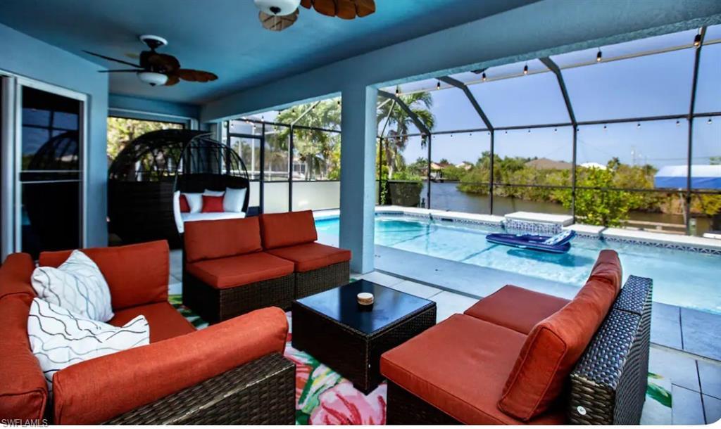 Image 1: Outdoor living with screened lanai, custom pool and spa