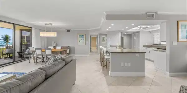 Image 3: Open living/dining room.