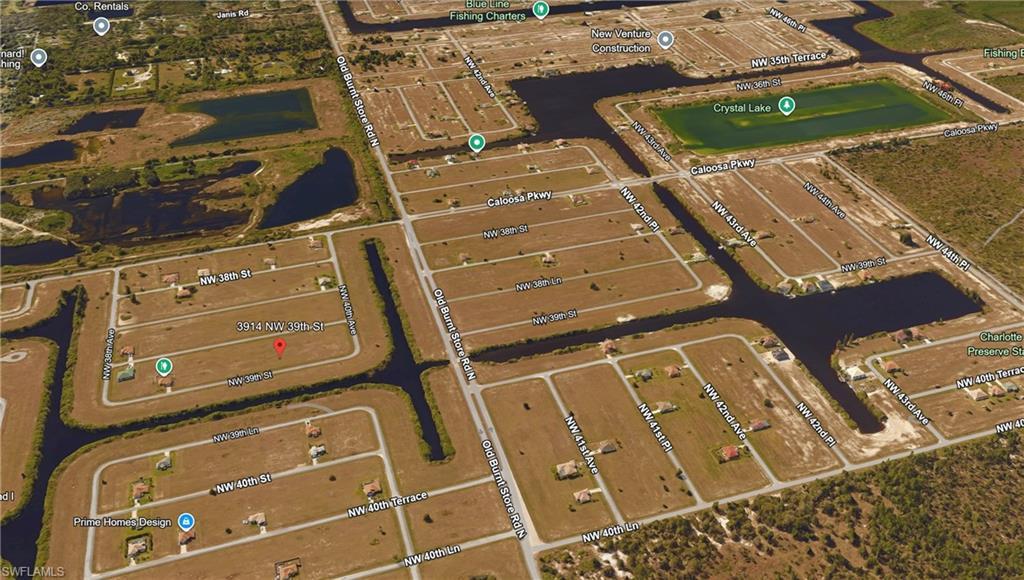 Image 2: Aerial view of property's location featuring a large body of water and nearby suburban area