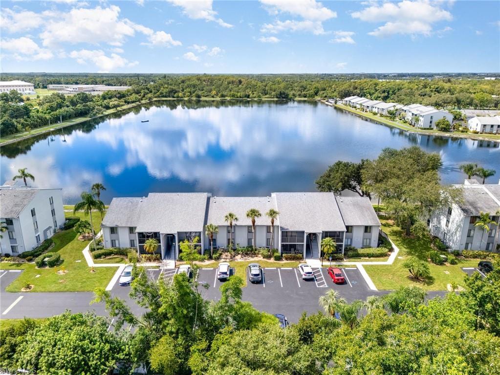 Image 4: Aerial view of the lake.  Unit #12 is in front of the red car on the second floor.