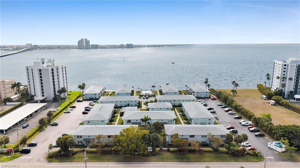 Image 3: Bird's eye view of a large body of water and apartment complex