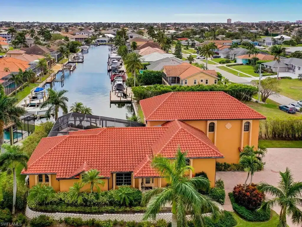 Image 1: Birds eye view of property with a water view