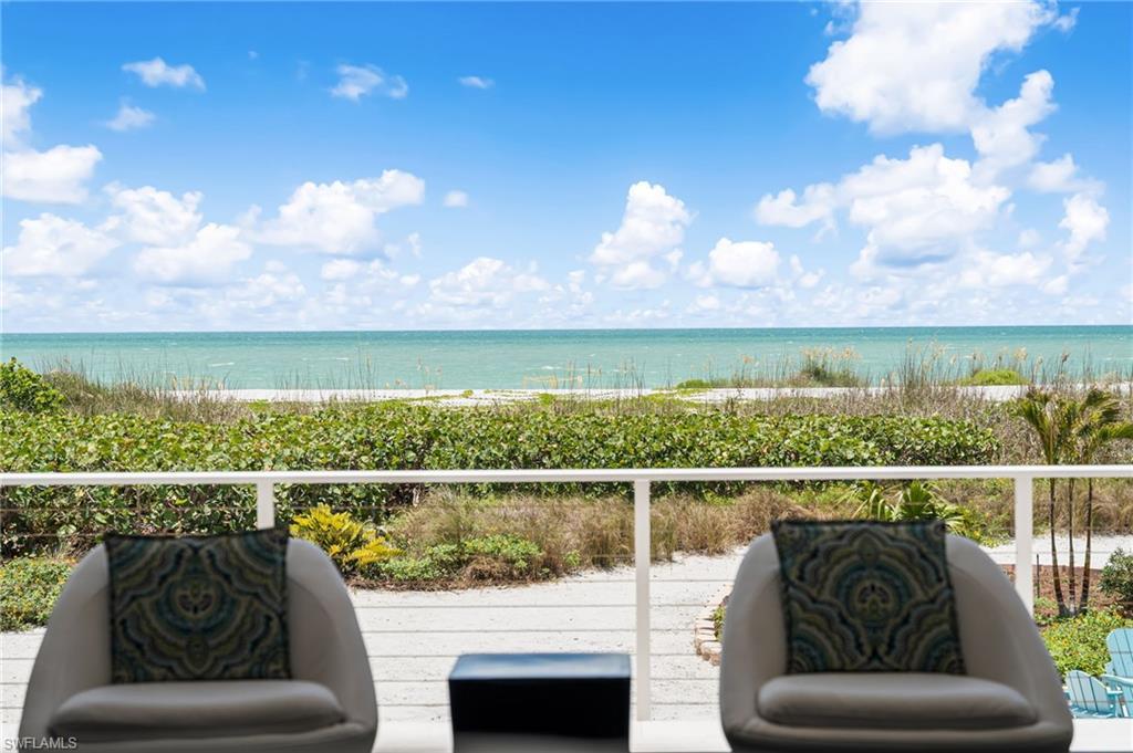 Image 1: Welcome to 4577 Waters Edge Lane, a beautifully renovated beachfront retreat on Sanibel Island.