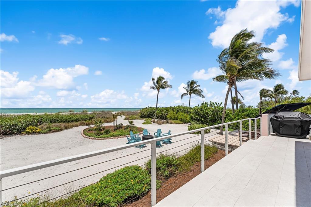 Image 4: Seamless indoor-outdoor living with panoramic beach views.