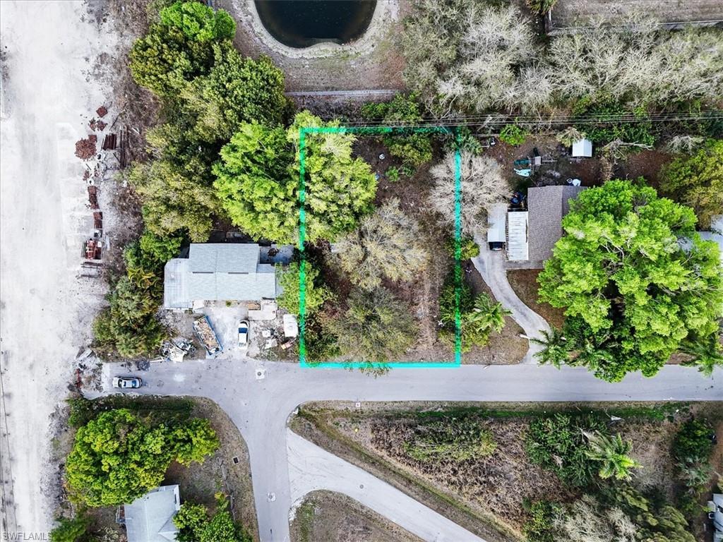 Image 3: Aerial view of property and surrounding area featuring property parcel outlined