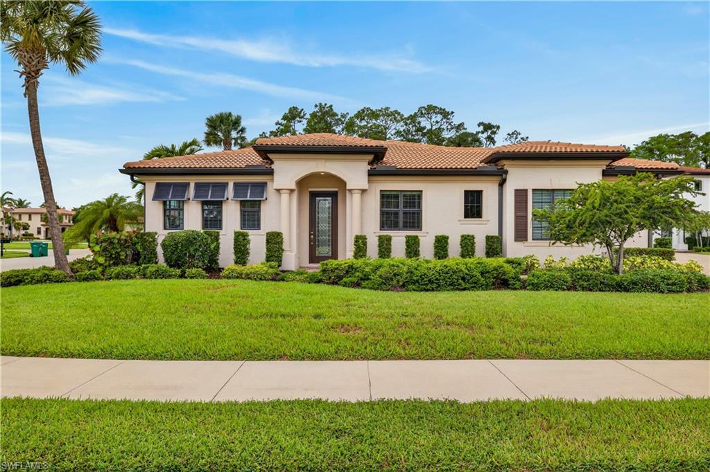 Image 1: One story single family home on a corner lot.