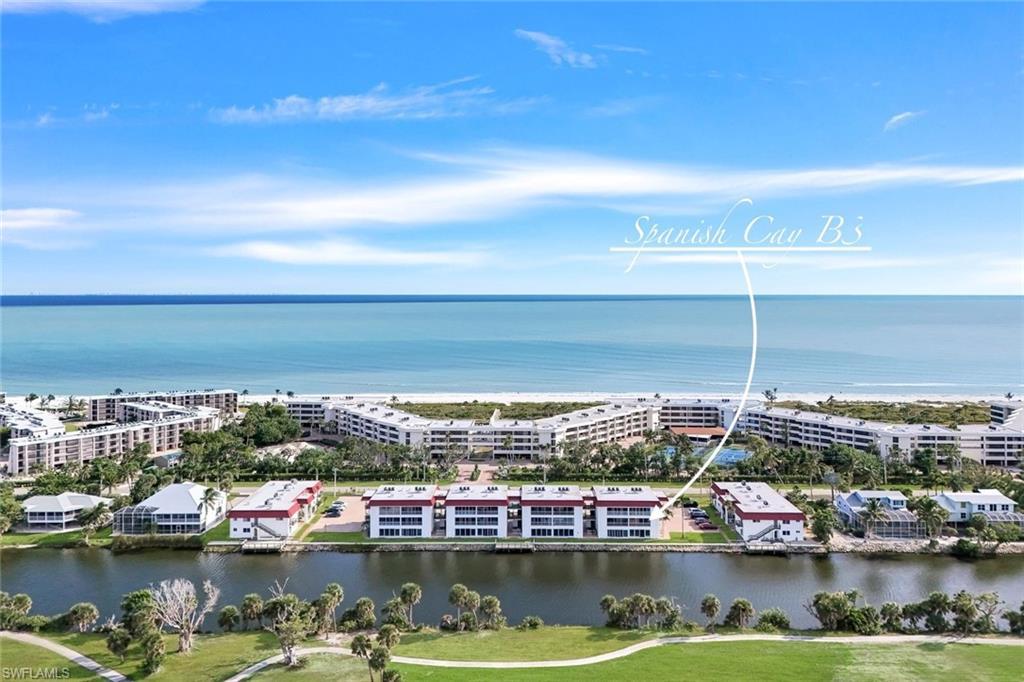 Image 1: Aerial view of apartment complex / building and a nearby body of water