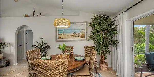 Image 3: DINING AREA LOOKING TOWARDS THE ENTRANCE TO HALLWAY TO GUEST BEDROOMS AND BATH