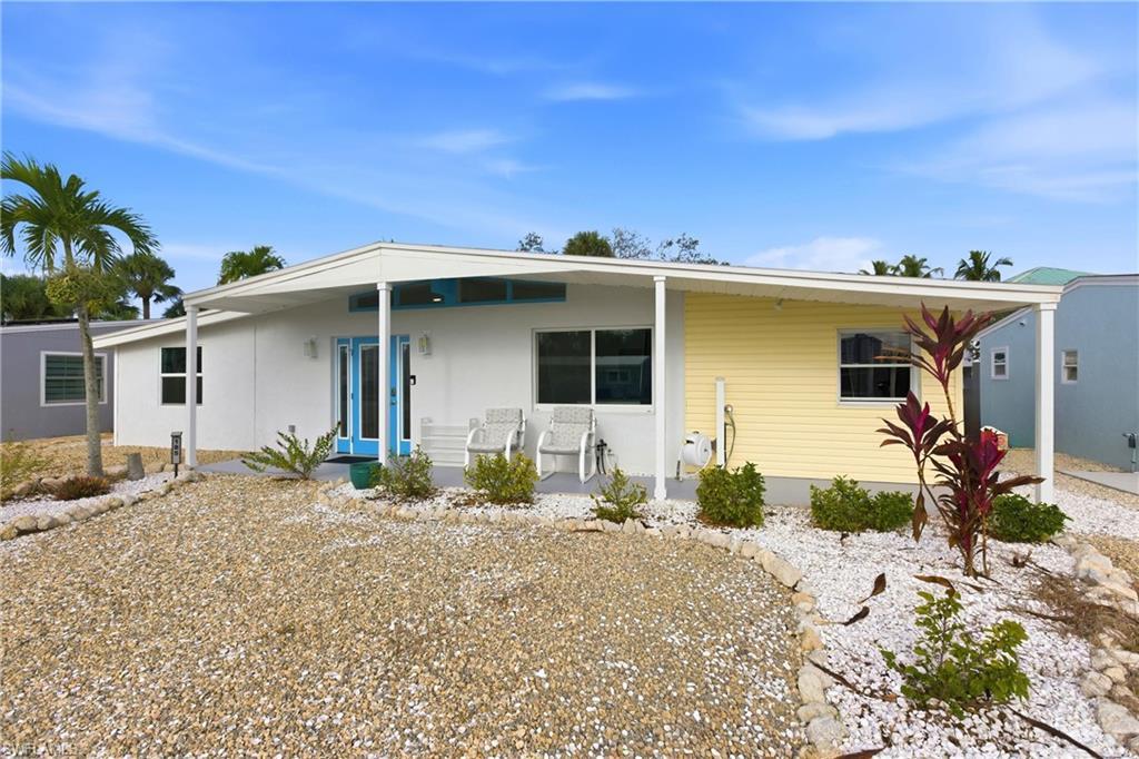 Image 2: View of front of property with a porch