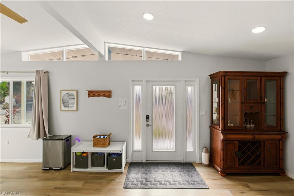 Image 4: Entryway featuring baseboards and light wood-style floors
