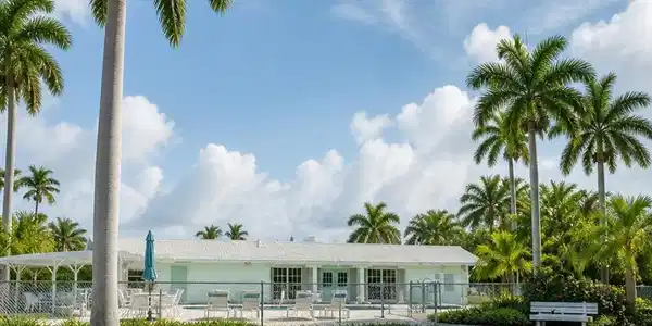 Image 2: Community club house & heated pool. Viewing from rear exposure (North)