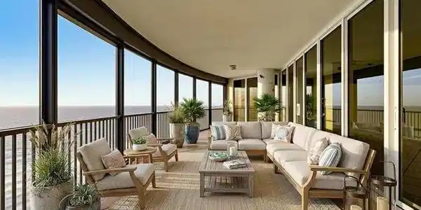Image 4: VIRTUALLY STAGED. Expansive curved balcony featuring floor-to-ceiling windows, black metal railings, and a textured ceiling