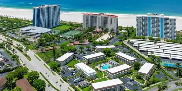 Image 2: Aerial overview of a coastal community featuring multiple residential buildings