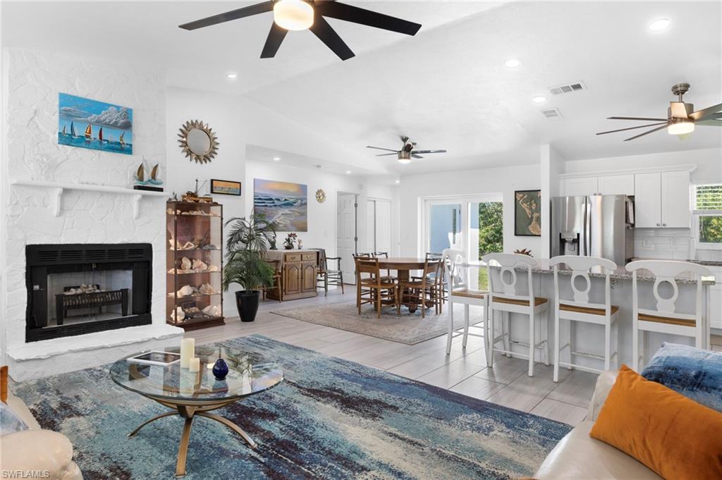 Image 2: Fresh, beautiful island feel complete with a fireplace if it gets chilly during the winter!