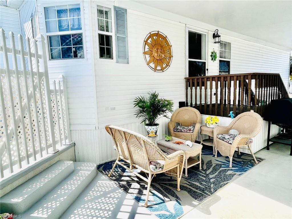Image 1: Main entry from carport, gate to courtyard and pool