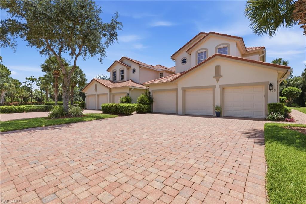 Image 2: Mediterranean-style residence featuring a tile roof and stucco exterior