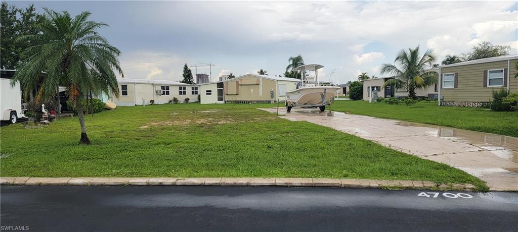 Image 3: View of property with a front yard