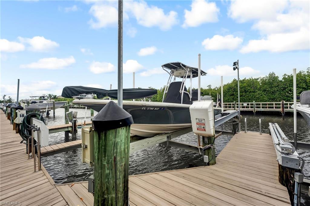 Image 2: Boat slip #18 offers a 10,000# lift. Slip #18 is assigned to the seller and can accomodate a 28' vessel.