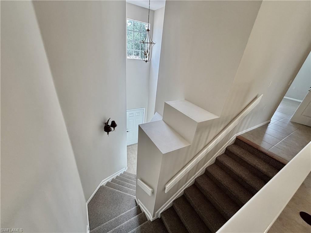 Image 4: Stairway view to 1st floor garage and entry