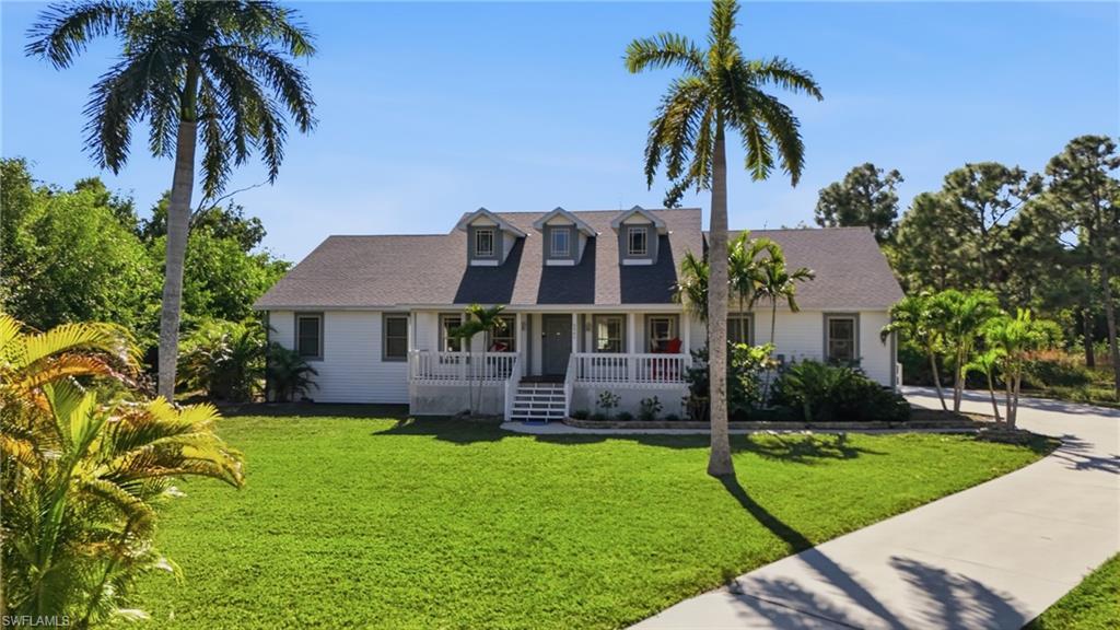 Image 2: Swaying palms and a Southern-style front porch welcomes you home