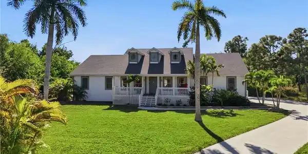 Image 2: Swaying palms and a Southern-style front porch welcomes you home