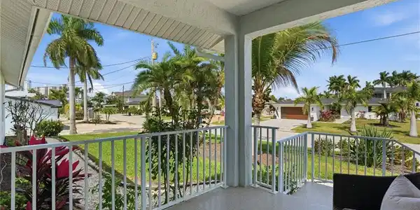 Image 4: Covered porch featuring a residential view - Virtually Edited Image