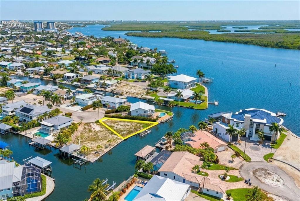 Image 4: Vacant waterfront lot with direct canal access - Virtually Edited Image