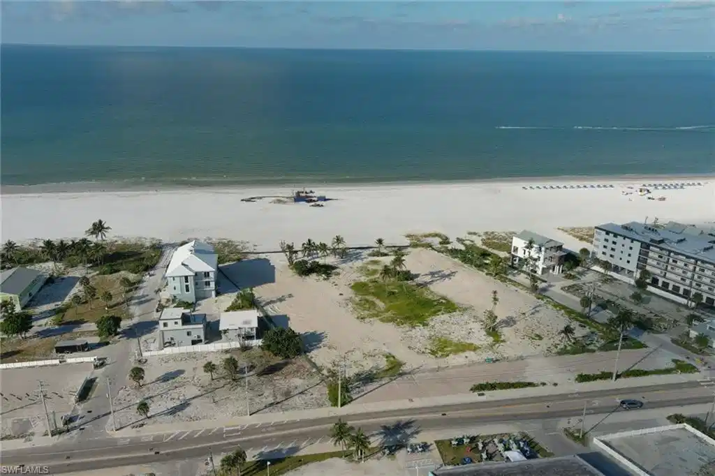 Image 1: Aerial view of property and surrounding area with extended coastline