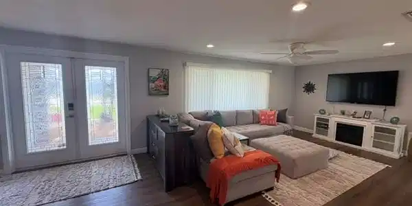 Image 4: OPEN FLOOR PLAN.  MANY LARGE WINDOWS PROVIDE AN ABUNDANCE OF NATURAL LIGHTING THROUGHOUT THIS HOME