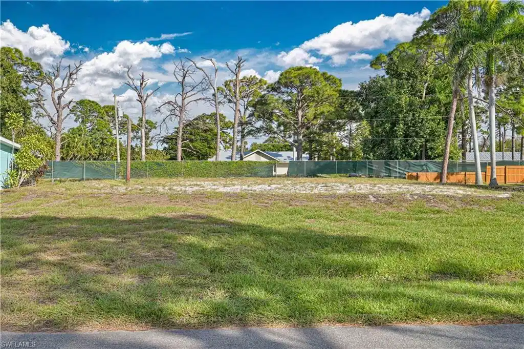 Image 1: View of yard with view of scattered trees