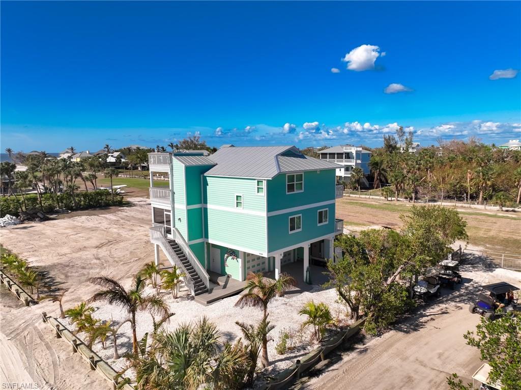 Image 3: Back of property with a balcony