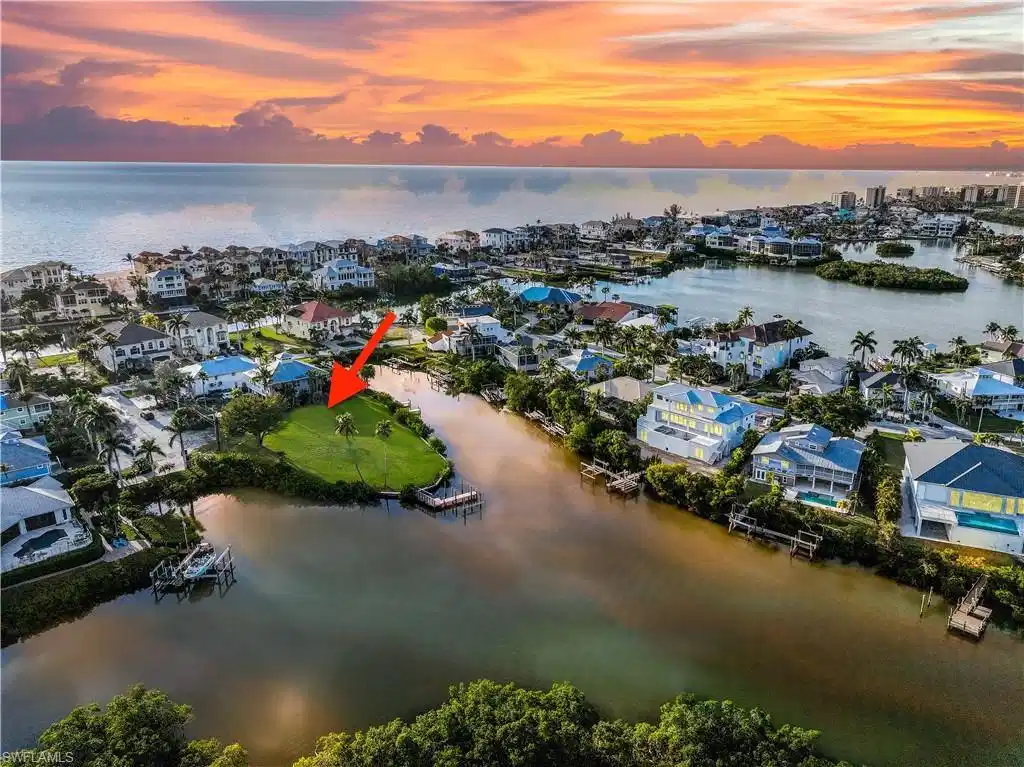 Image 1: Aerial view at dusk of a residential view and a water view