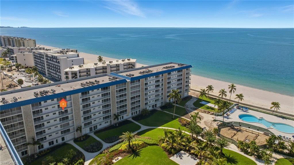 Image 2: Bird's eye view of apartment complex / building and unending shoreline