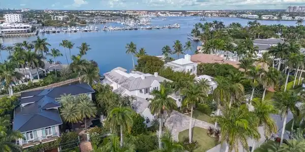 Image 2: Aerial view of property's location featuring a nearby body of water