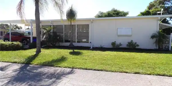 Image 2: View of home's community with a yard