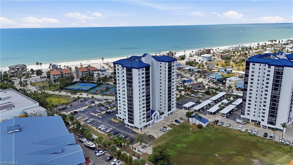 Image 3: Drone / aerial view of expansive beach and apartment complex - Virtually Edited Image