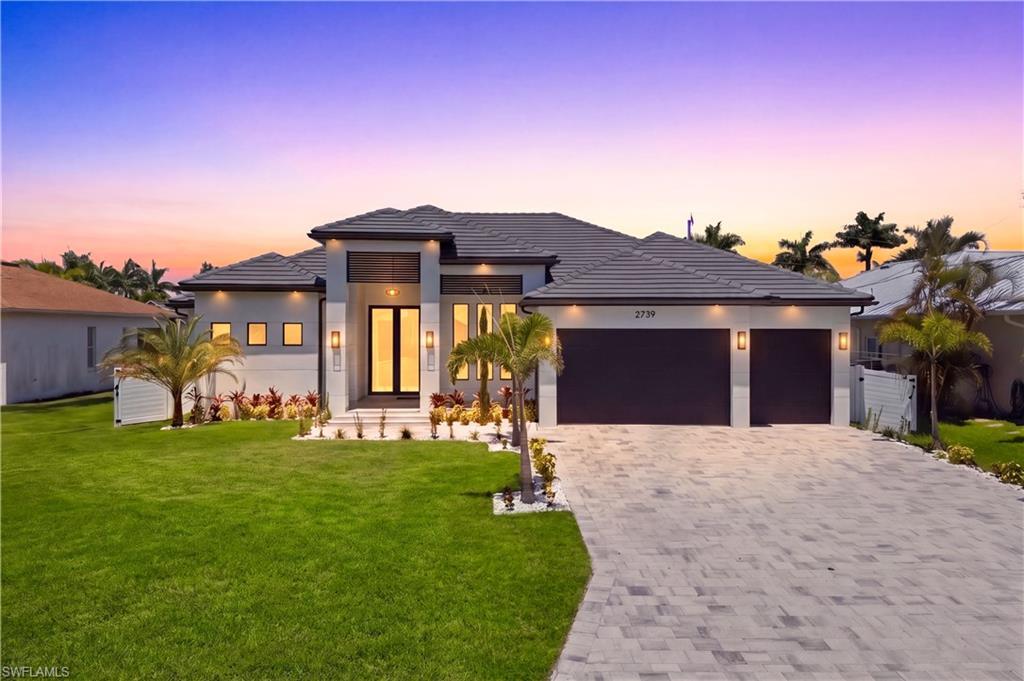 Image 3: 4 BEDS, DEN/OFFICE, 3 FULL BATHS & 2 HALF-BATHS, SCREENED LANAI and IDEAL setting for RELAXING in the POOL SHELF, SWIMMING in the POOL, or HOSTING BBQs