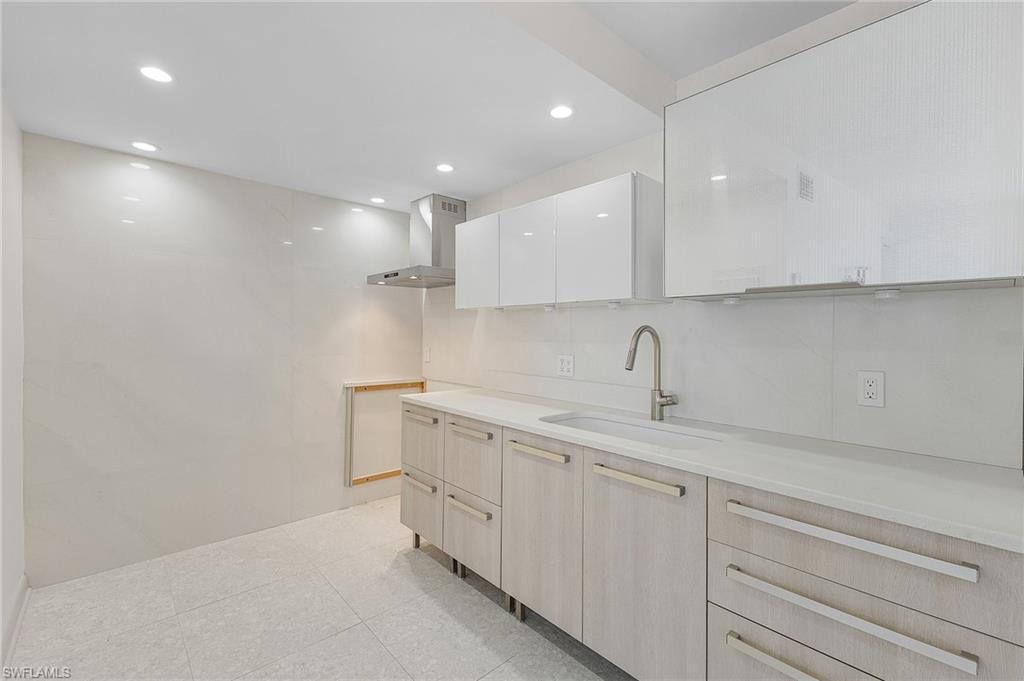 Image 3: Bright Beautiful Kitchen with Chic Tile Wall