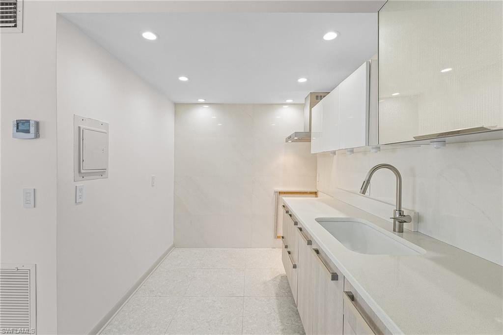 Image 4: Bright Beautiful Kitchen with Chic Tile Wall
