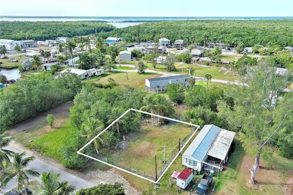 Image 1: Aerial view of property's location featuring property boundaries highlighted