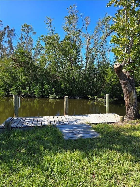 Image 3: Dock area featuring a water view