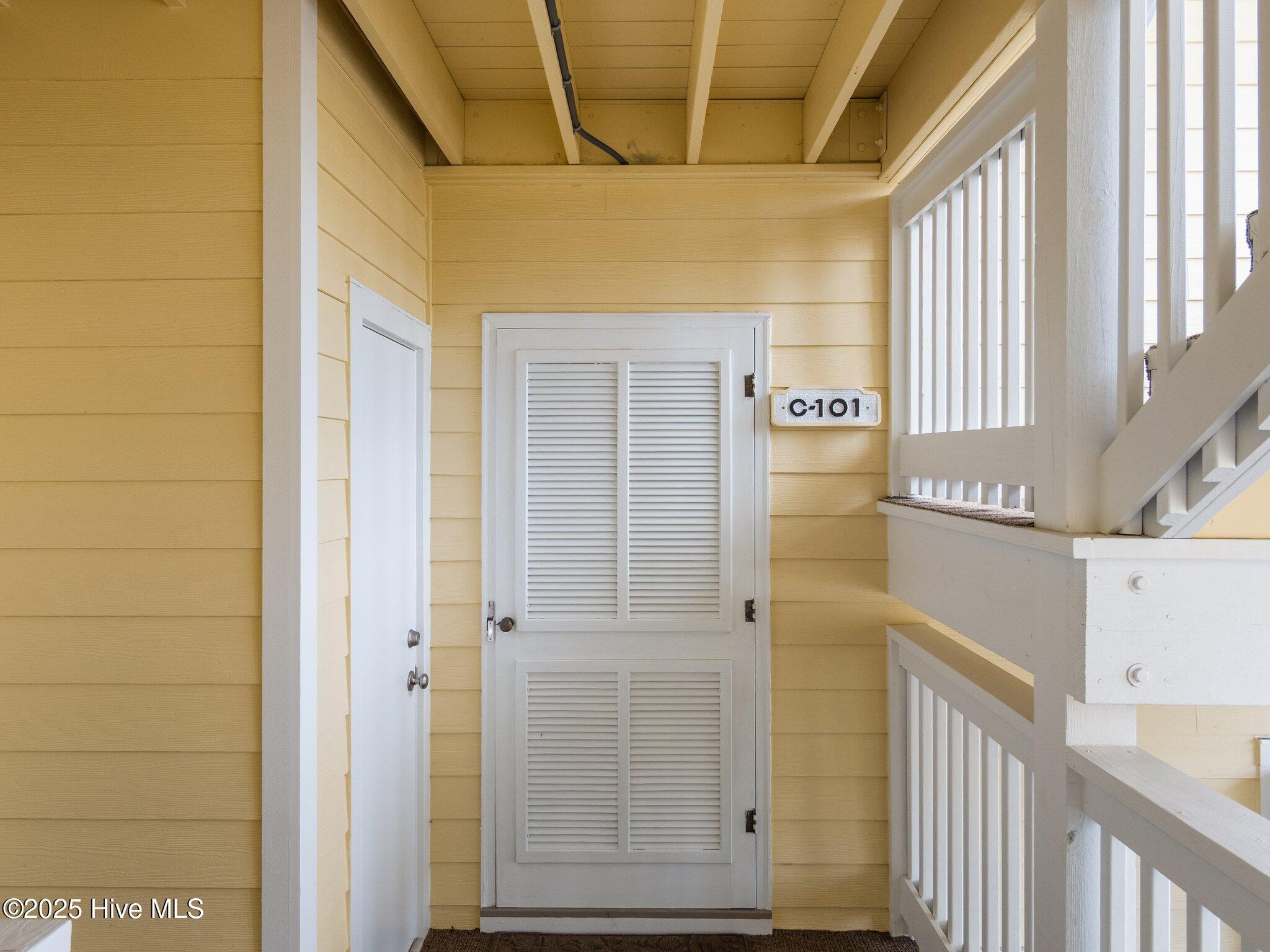 Image 1: Front Door and Enclosed Storage Closet
